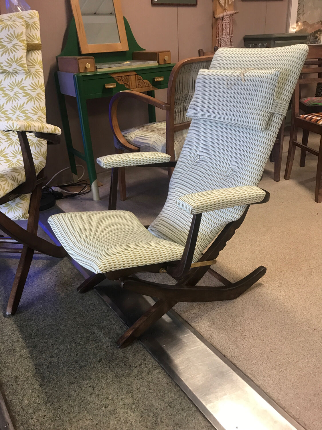 Rocking lounge chair made of fabric suitable for outdoor use.