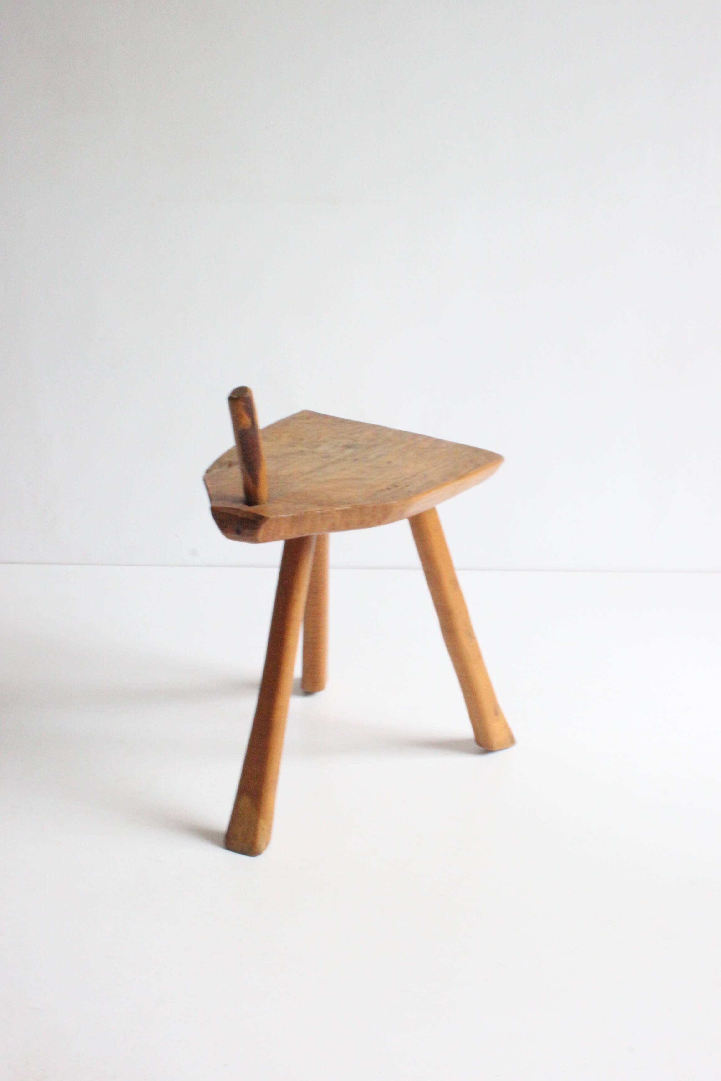 Brutalist tripod stool in carved wood, 1950s