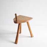 Brutalist tripod stool in carved wood, 1950s
