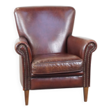 Sheepskin armchair correctly finished with decorative nails and in good condition