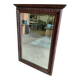 Large bevelled mirror with a carved wooden frame