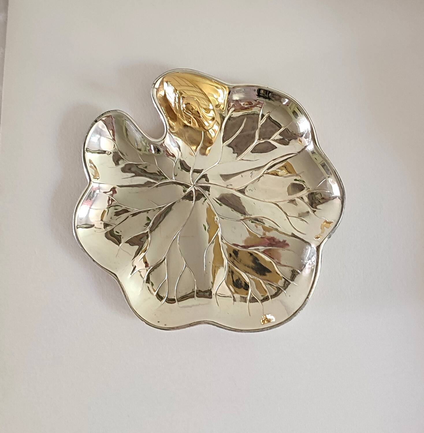 A Lancel pocket tray in silver metal.