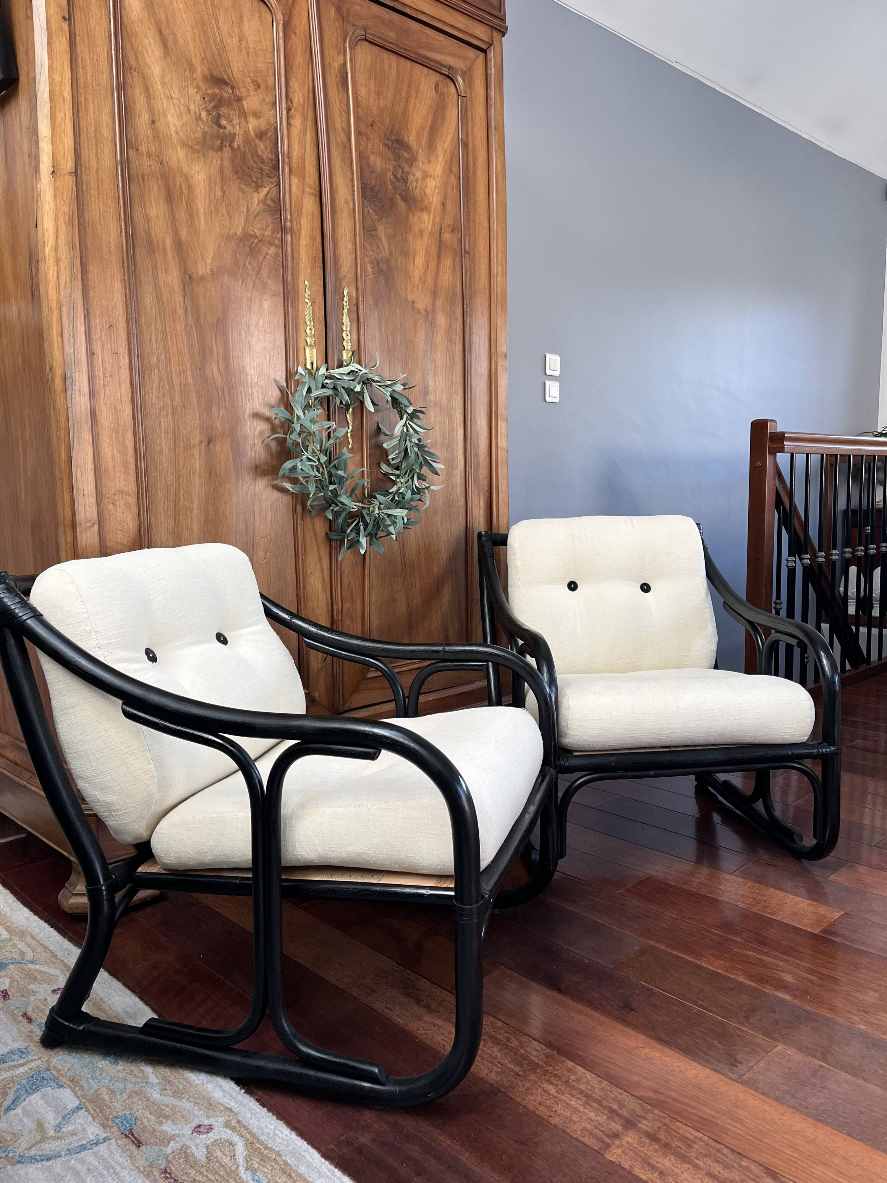 Set of two vintage black and white bamboo chairs.