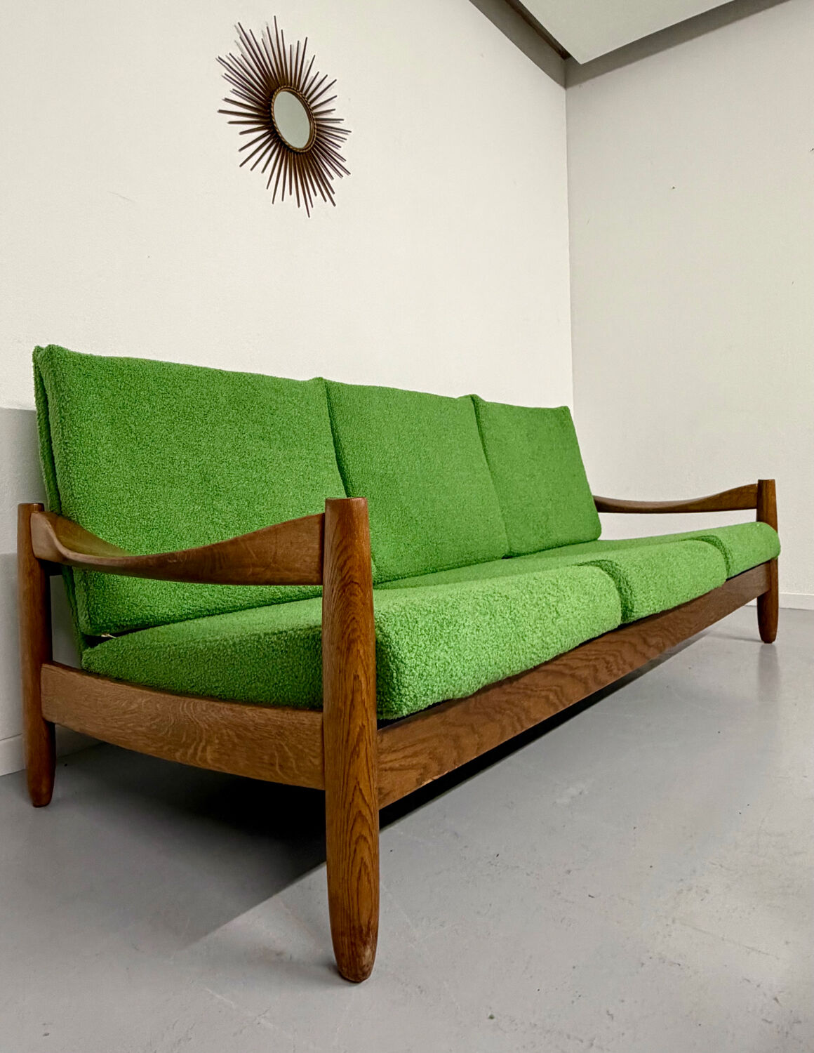 Living room sofa and Scandinavian design armchairs from the 1960s in green boucle.