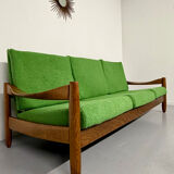 Living room sofa and Scandinavian design armchairs from the 1960s in green boucle.