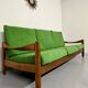 Living room sofa and Scandinavian design armchairs from the 1960s in green boucle.