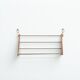 Wall-mounted walnut bookshelf by Carl Auböck, 1950s