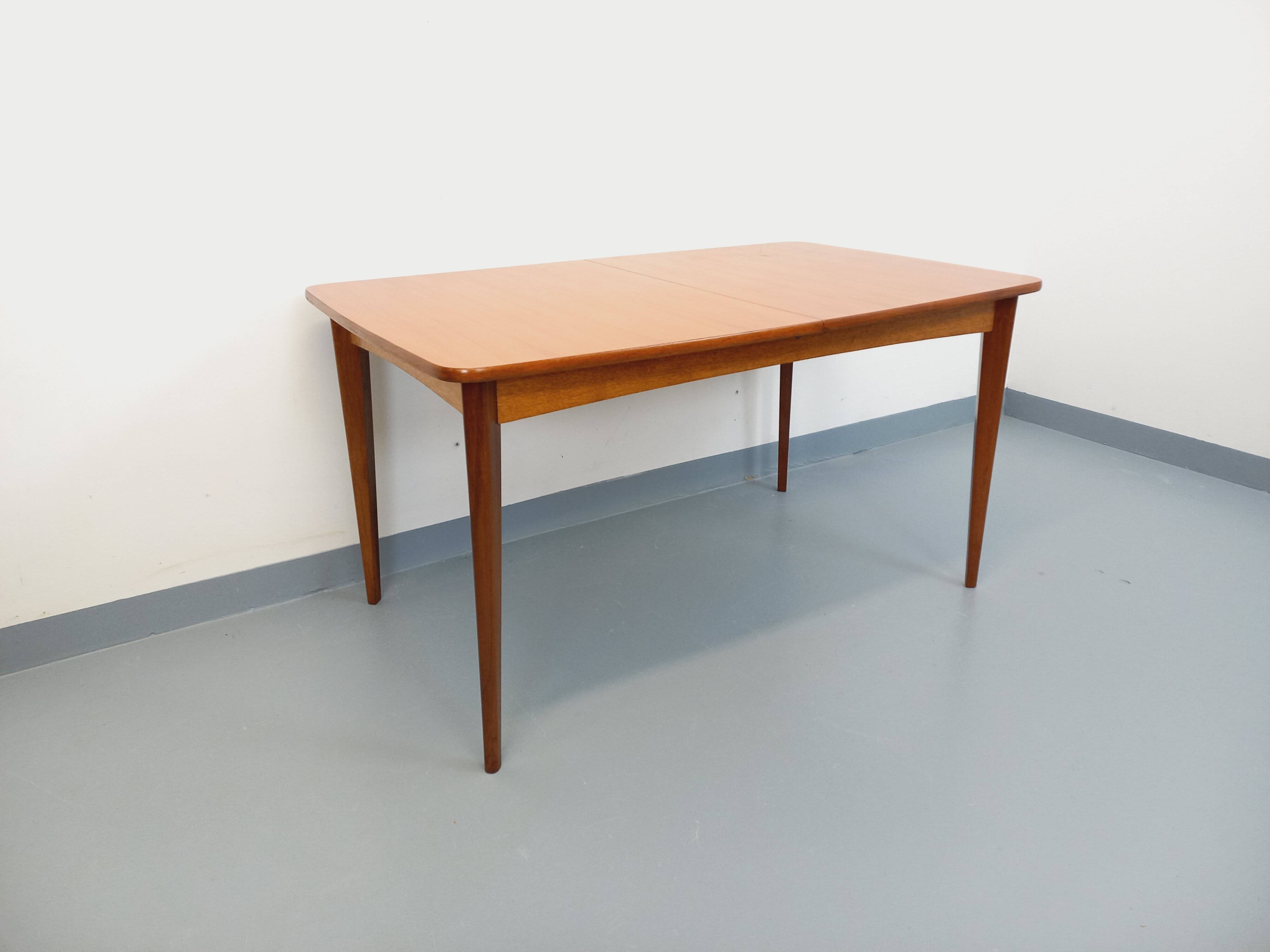 Rectangular dining table in vintage Scandinavian style from the 50s and 60s, made of teak.