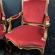 Pair of flat-back armchairs in Louis XV style in red velvet.