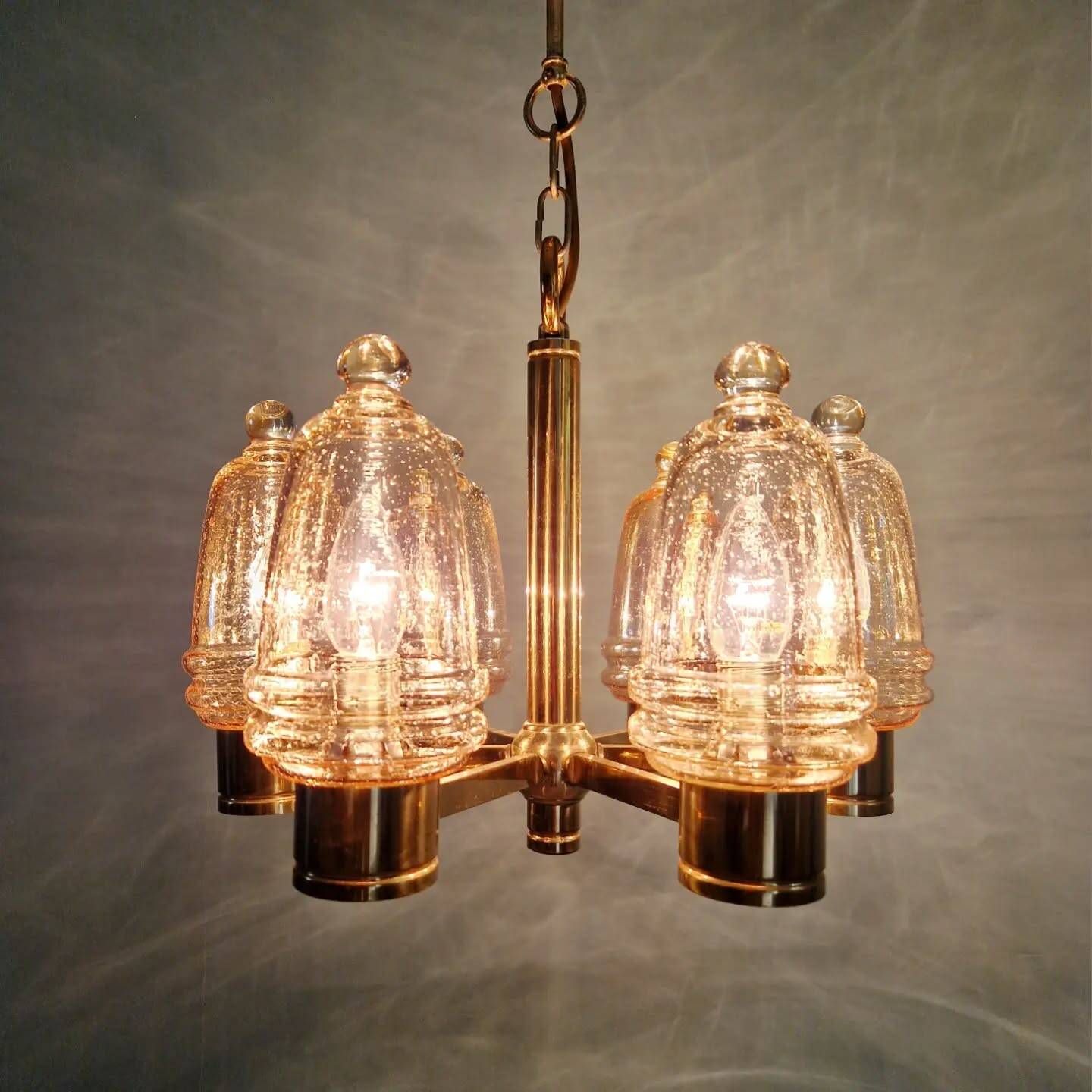 Brass chandelier with amber bubbled glass globes, 1970.
