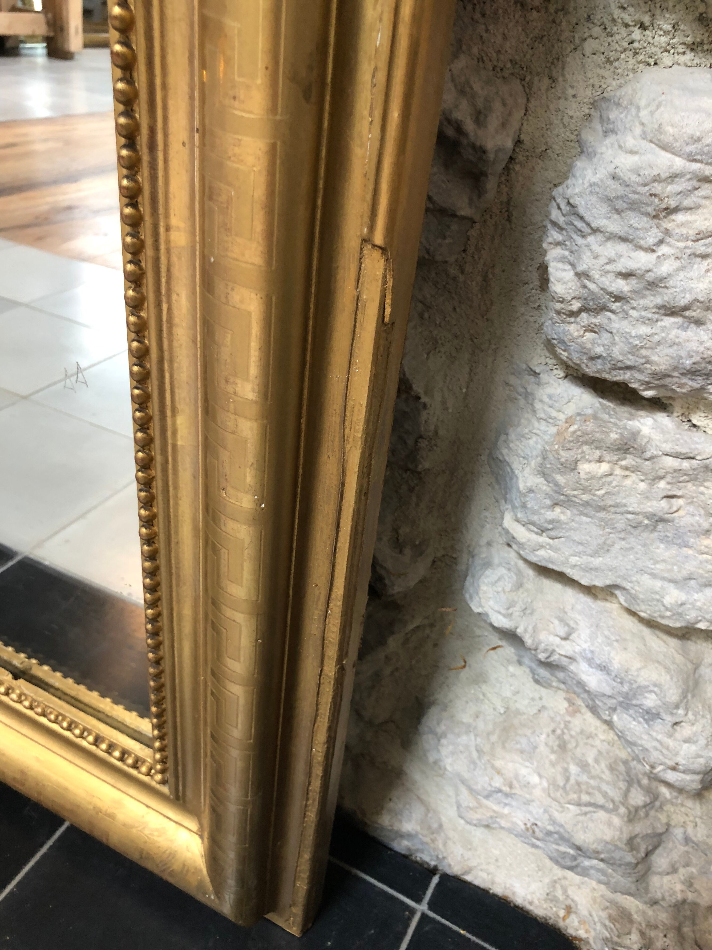 Louis-Philippe mirror pearled gold with gold leaf, some imperfections 146cm / 101cm