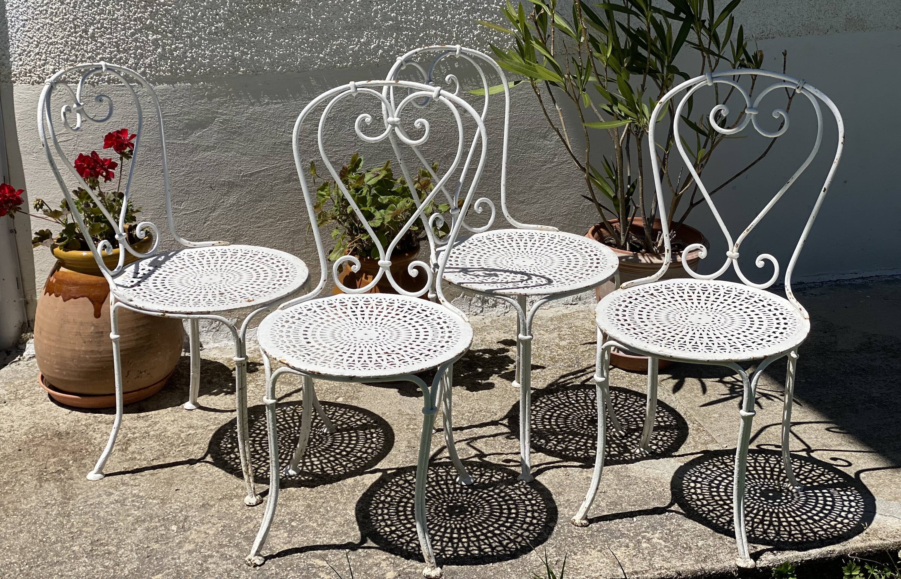 Set of 4 19th century wrought iron garden chairs with heart motif