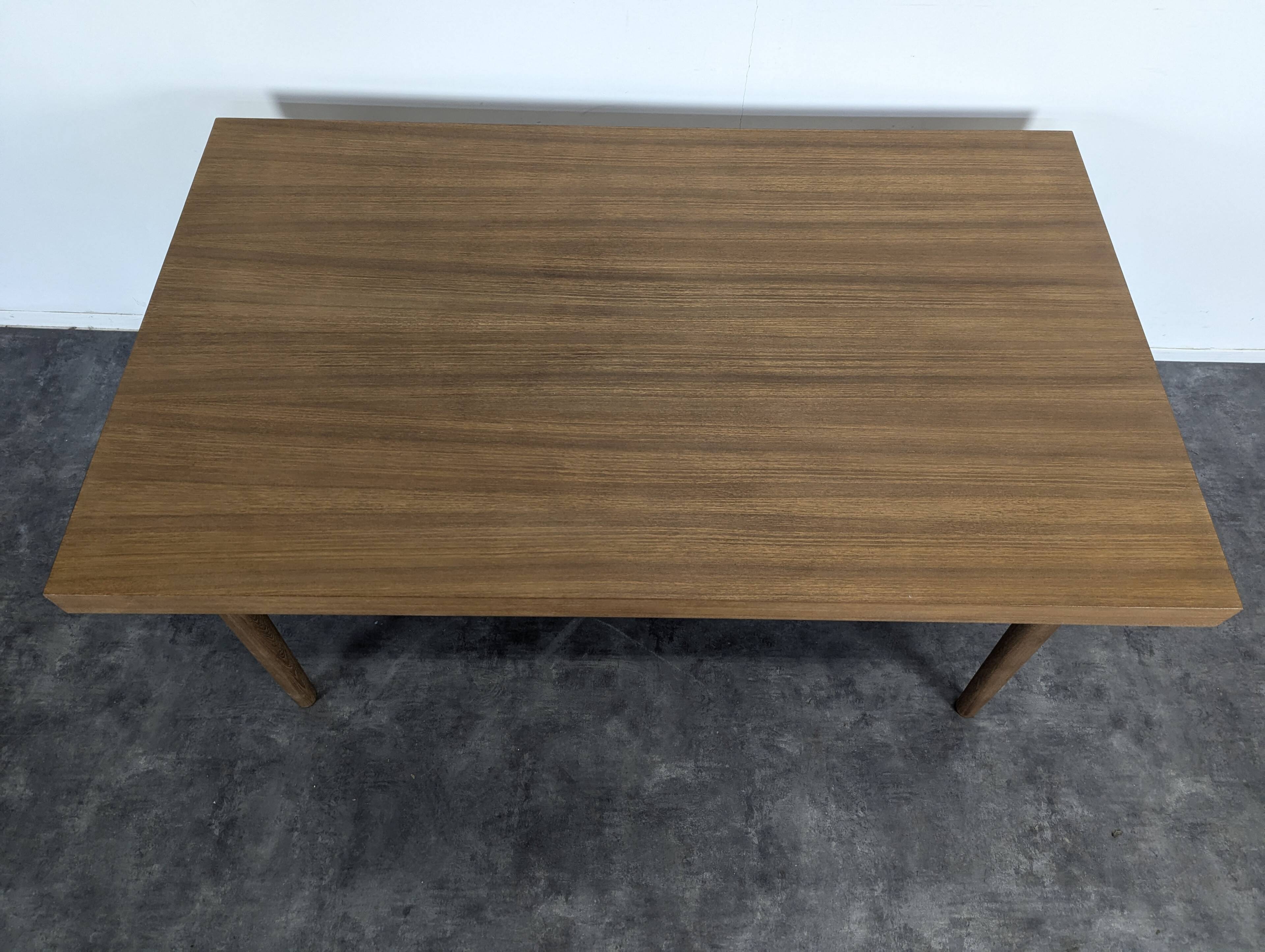 Modernist teak table with 2 extensions.