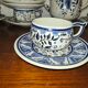 Henriot Quimper earthenware coffee set with floral decoration and elegant blue