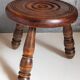 Low tripod stool in vintage turned solid wood