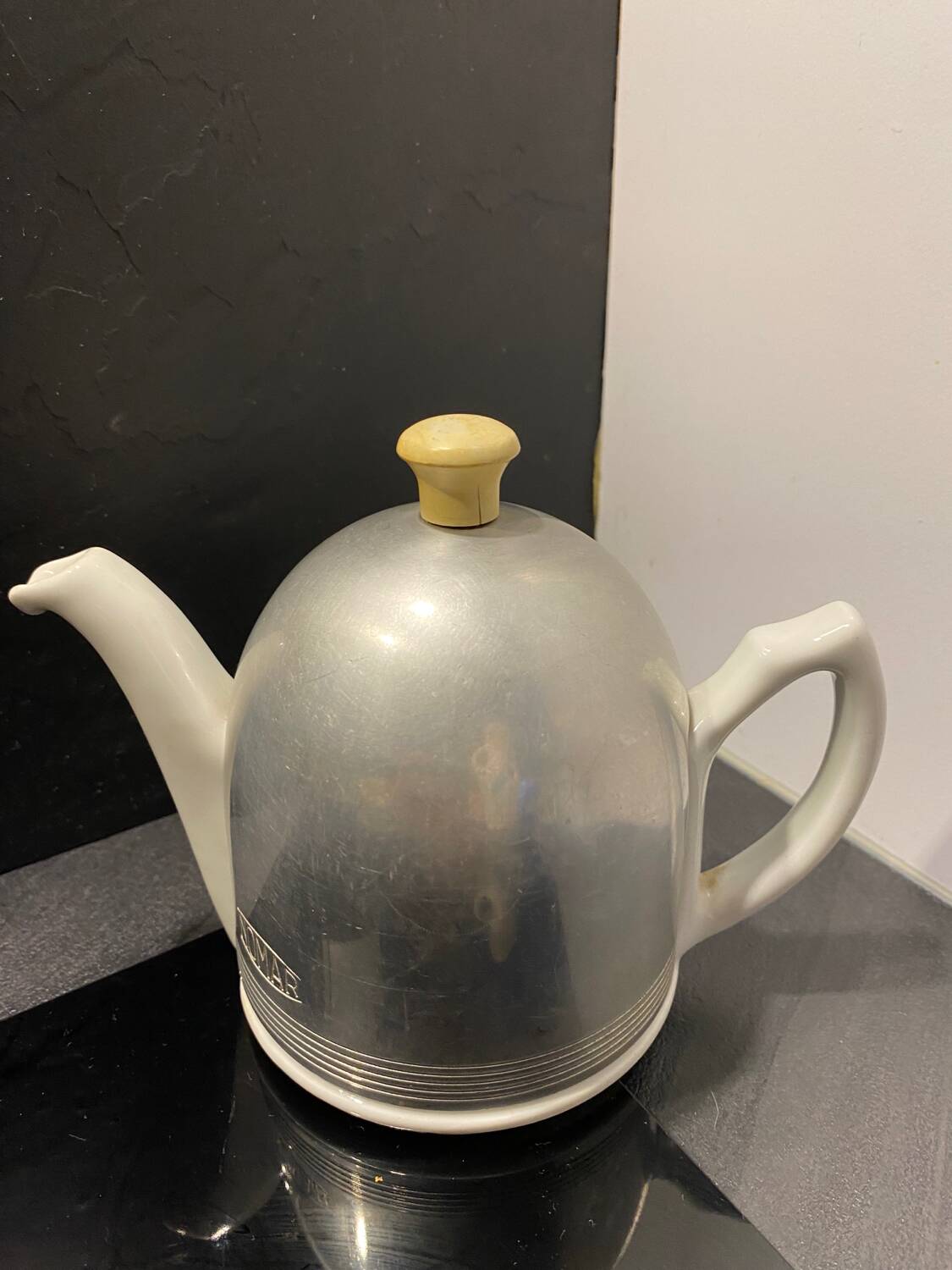 Nomar porcelain and steel teapot