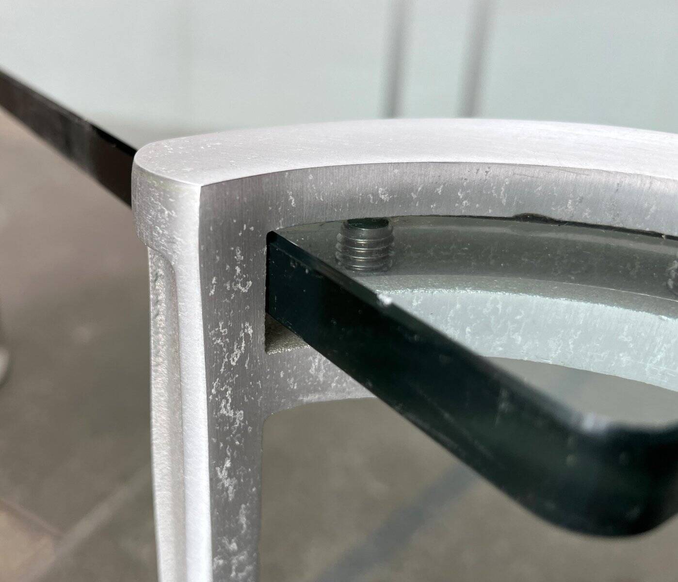 Vintage Space Age coffee table in glass and aluminium attributed to Peter Ghyczy, 1970s.