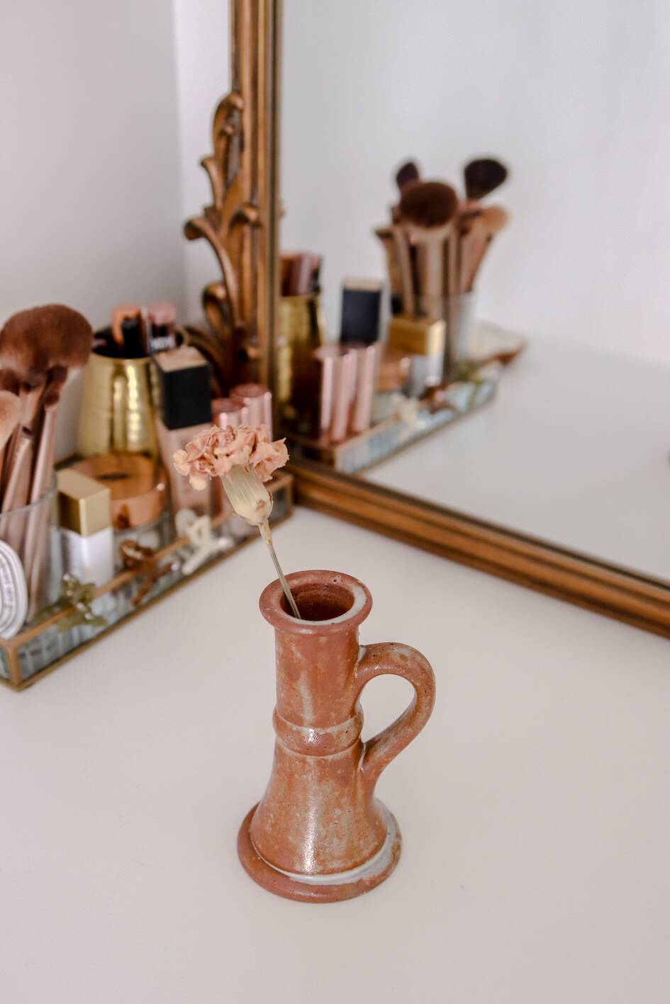 Set of two terracotta candle holders.