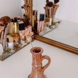 Set of two terracotta candle holders.