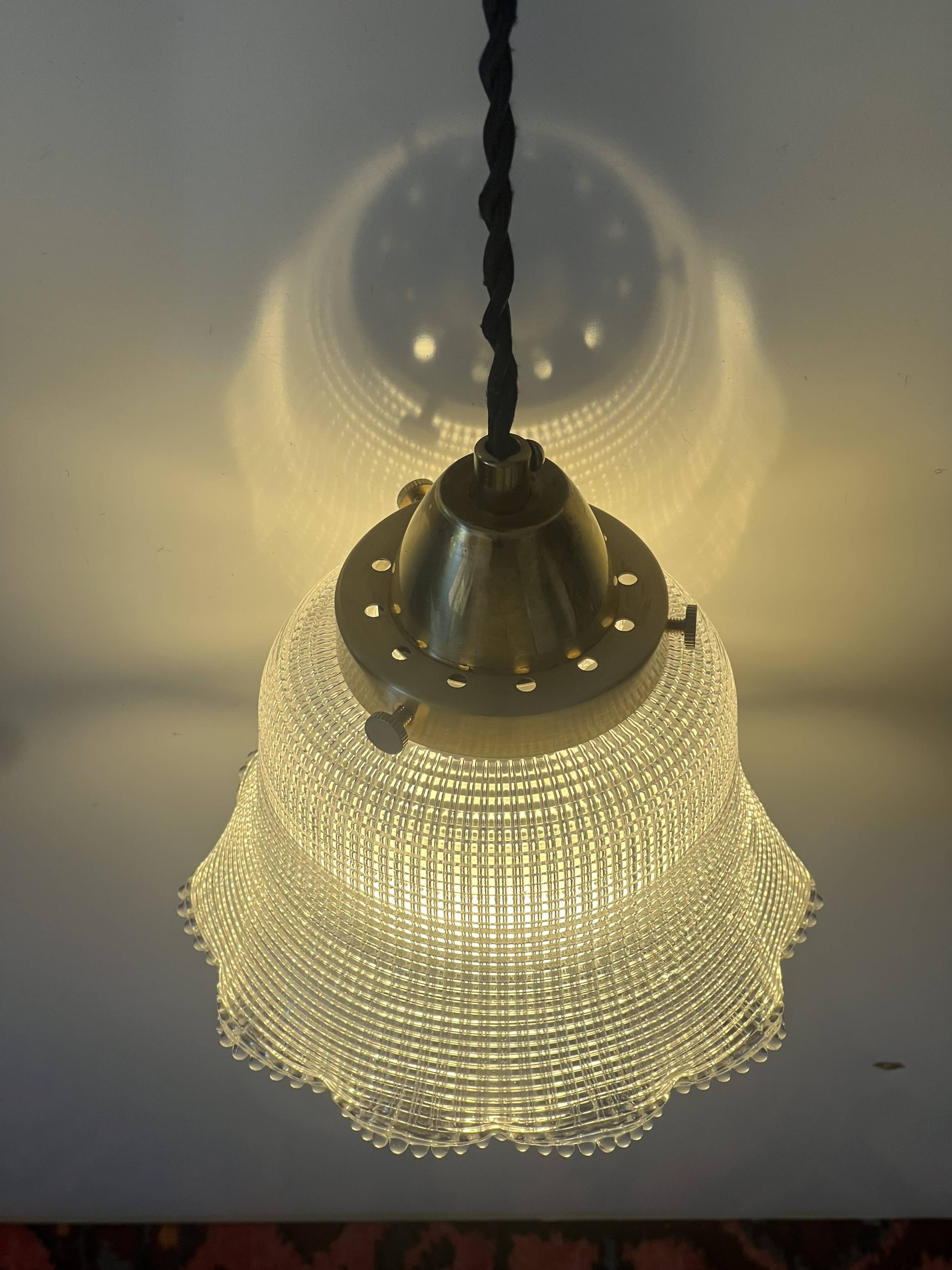 Industrial Holophane glass portable lamp with brass hook