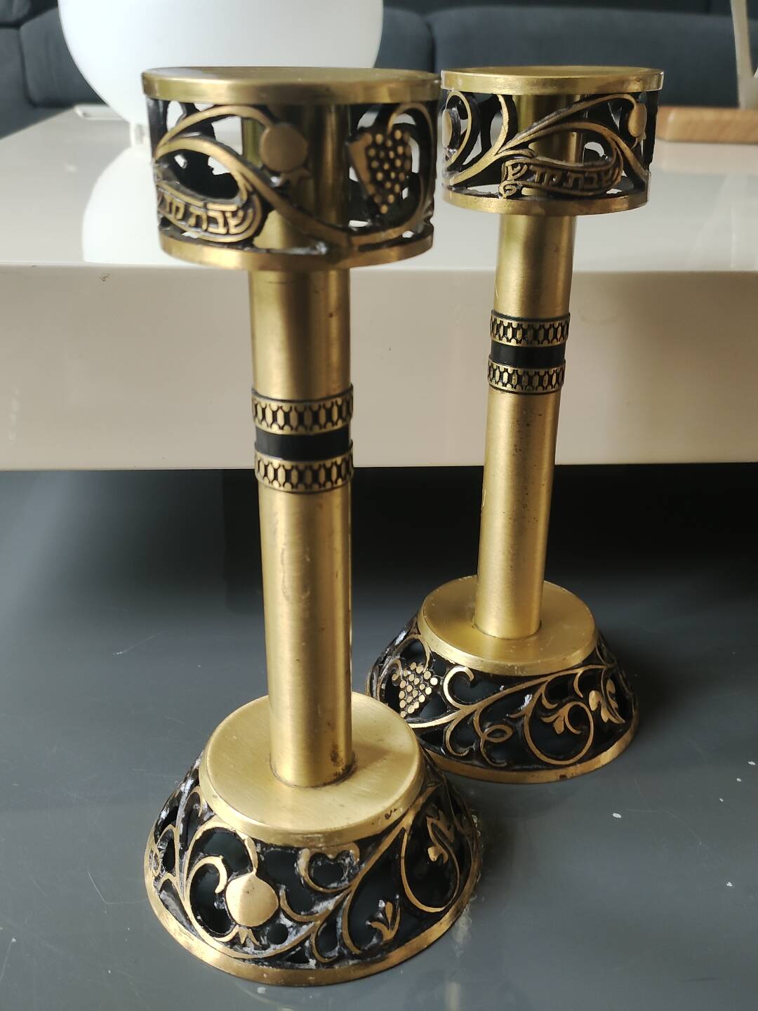 Pair of Hebrew Candlesticks. In antique gold-plated brass. Signed FFS Israel
