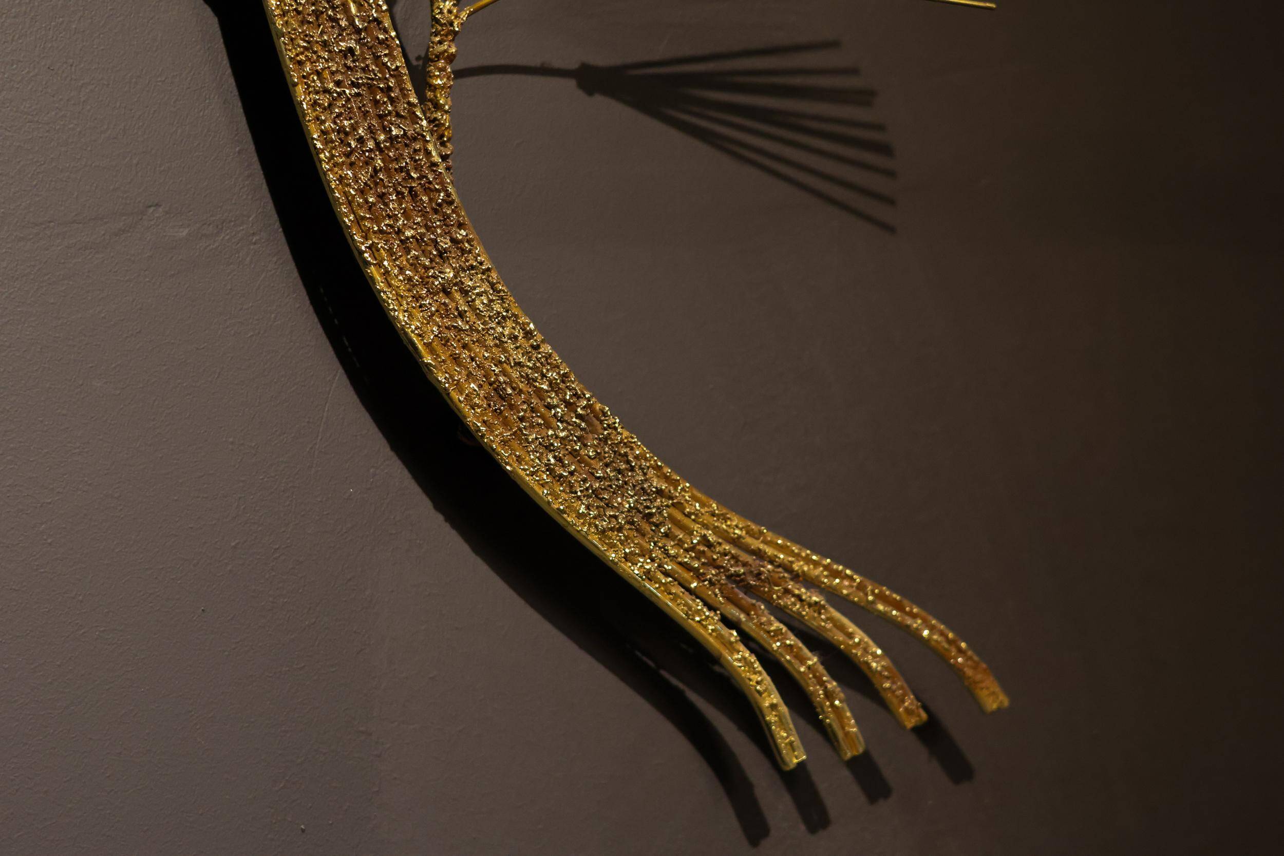 Large wall sculpture in the shape of a tree needle in brass by Curtis Jeré, mid-century modern.