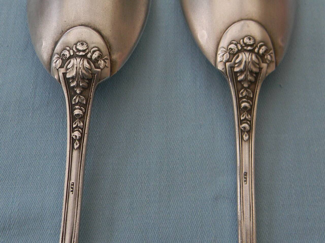 SFAM silver metal salad servers.