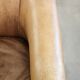 Vintage cowhide club armchair in English style in a light colour scheme