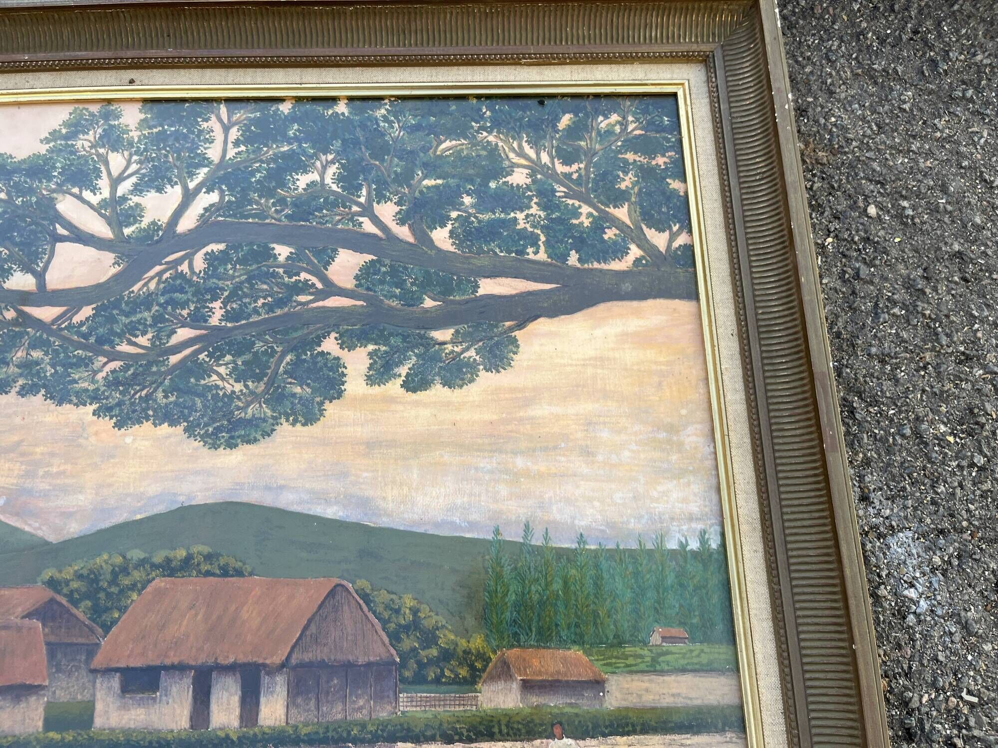 Large naive oil painting signed Medrano: rice field and buffalo, village with roofs of