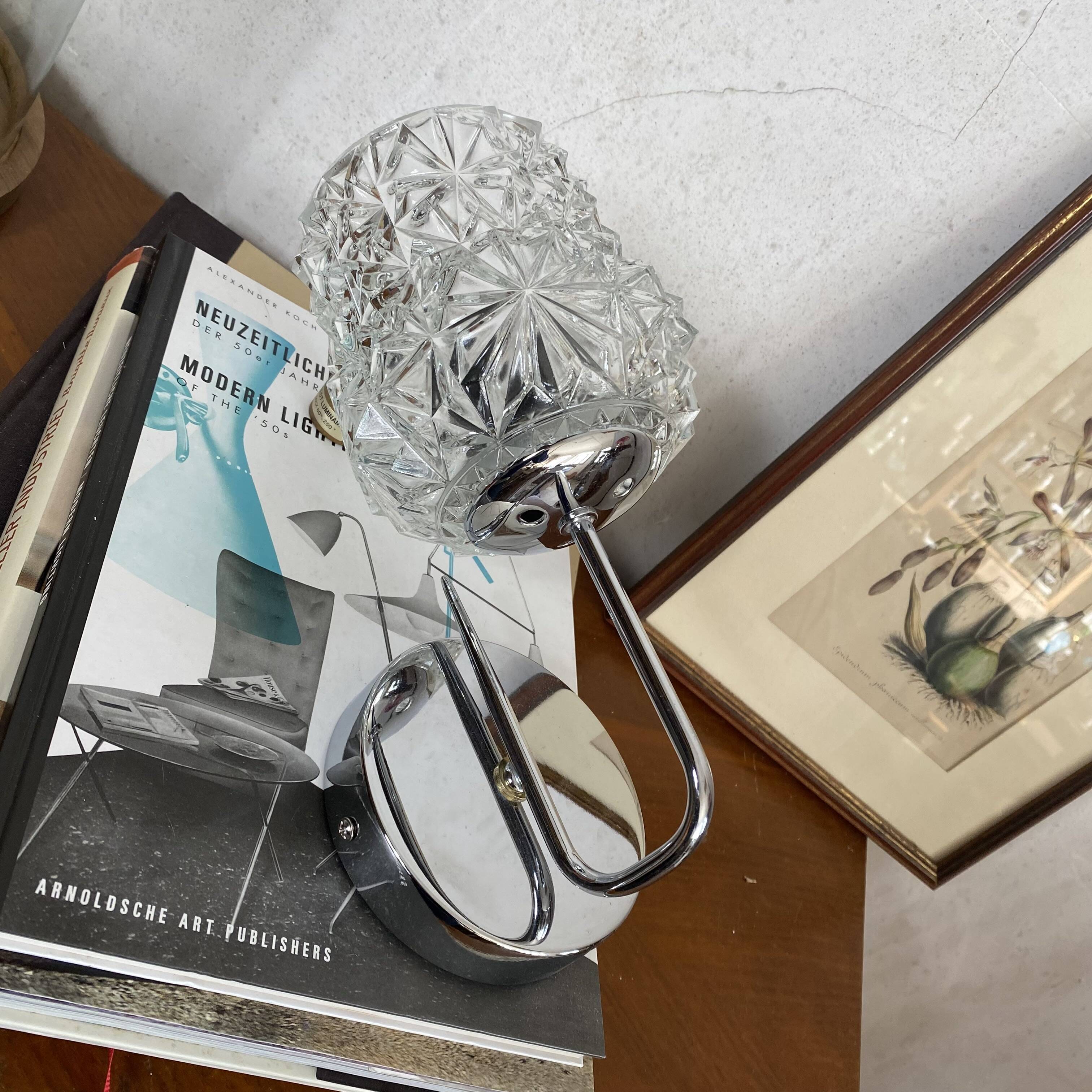 Swan neck wall light in stainless steel, thick glass shade, stainless steel rose.