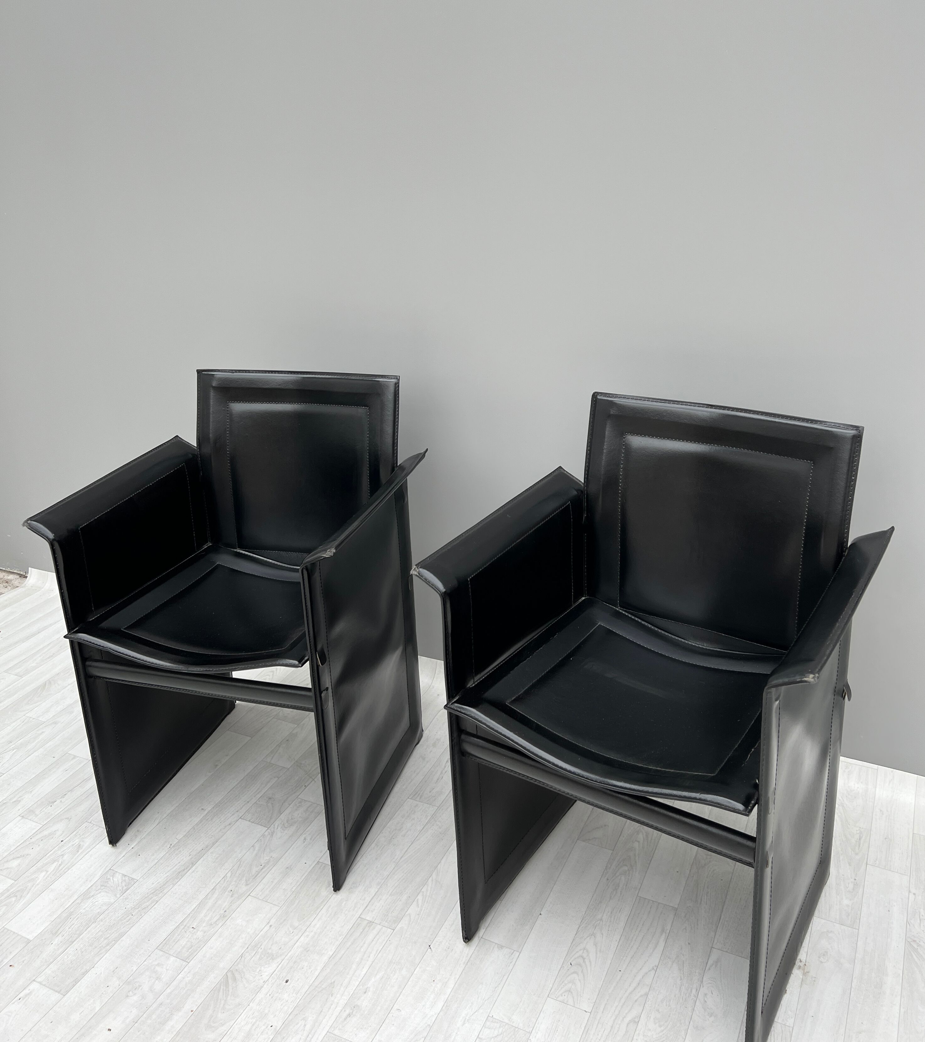Pair of armchairs in black leather