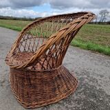 Old throne basket armchair in woven wicker