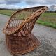 Old throne basket armchair in woven wicker