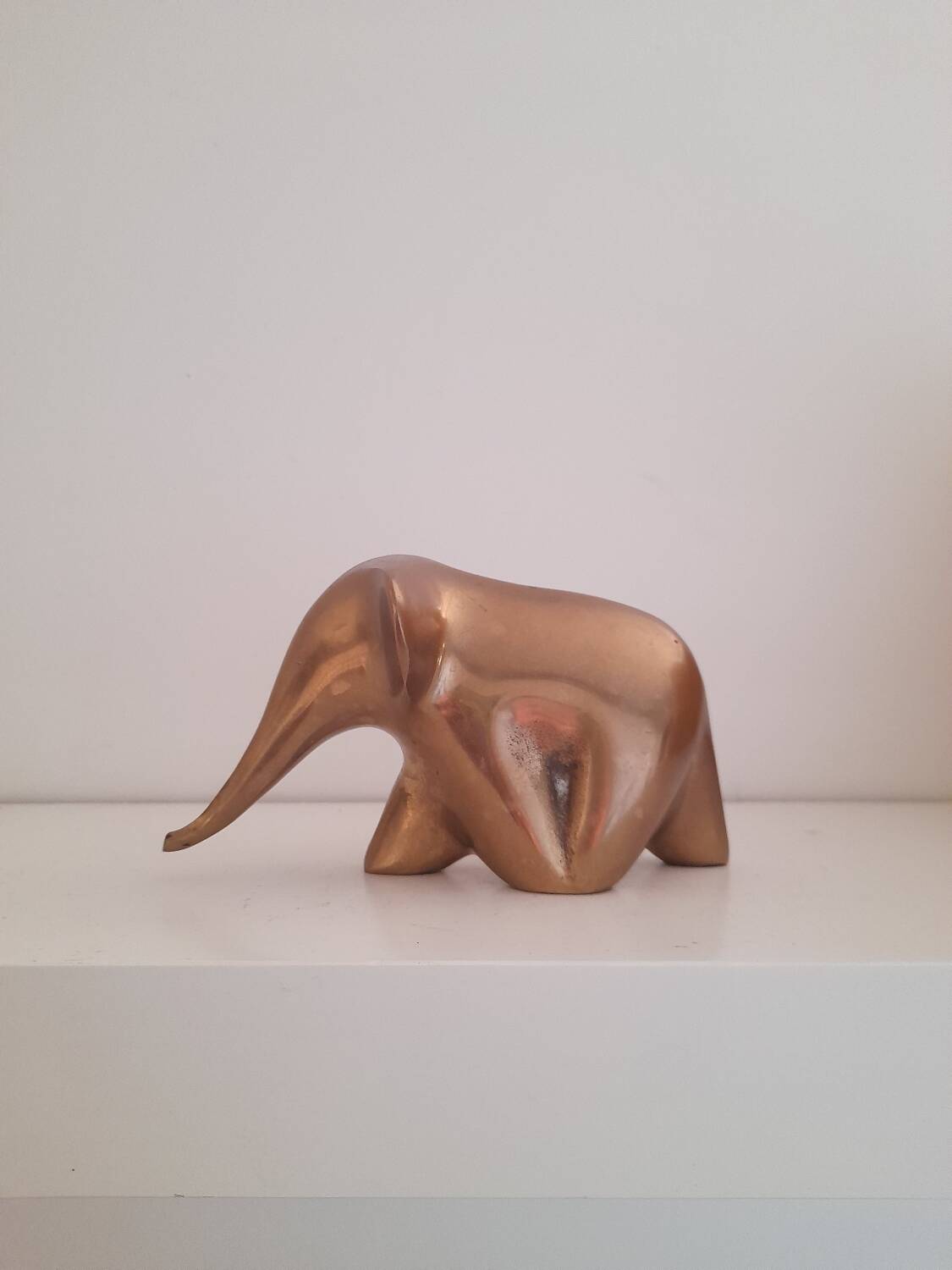 Stylized brass elephant paperweight