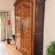 Large cherry wood wardrobe in sculpted provincial Louis XV style.