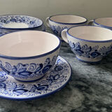 Set of 4 white/blue ceramic cups and saucers.