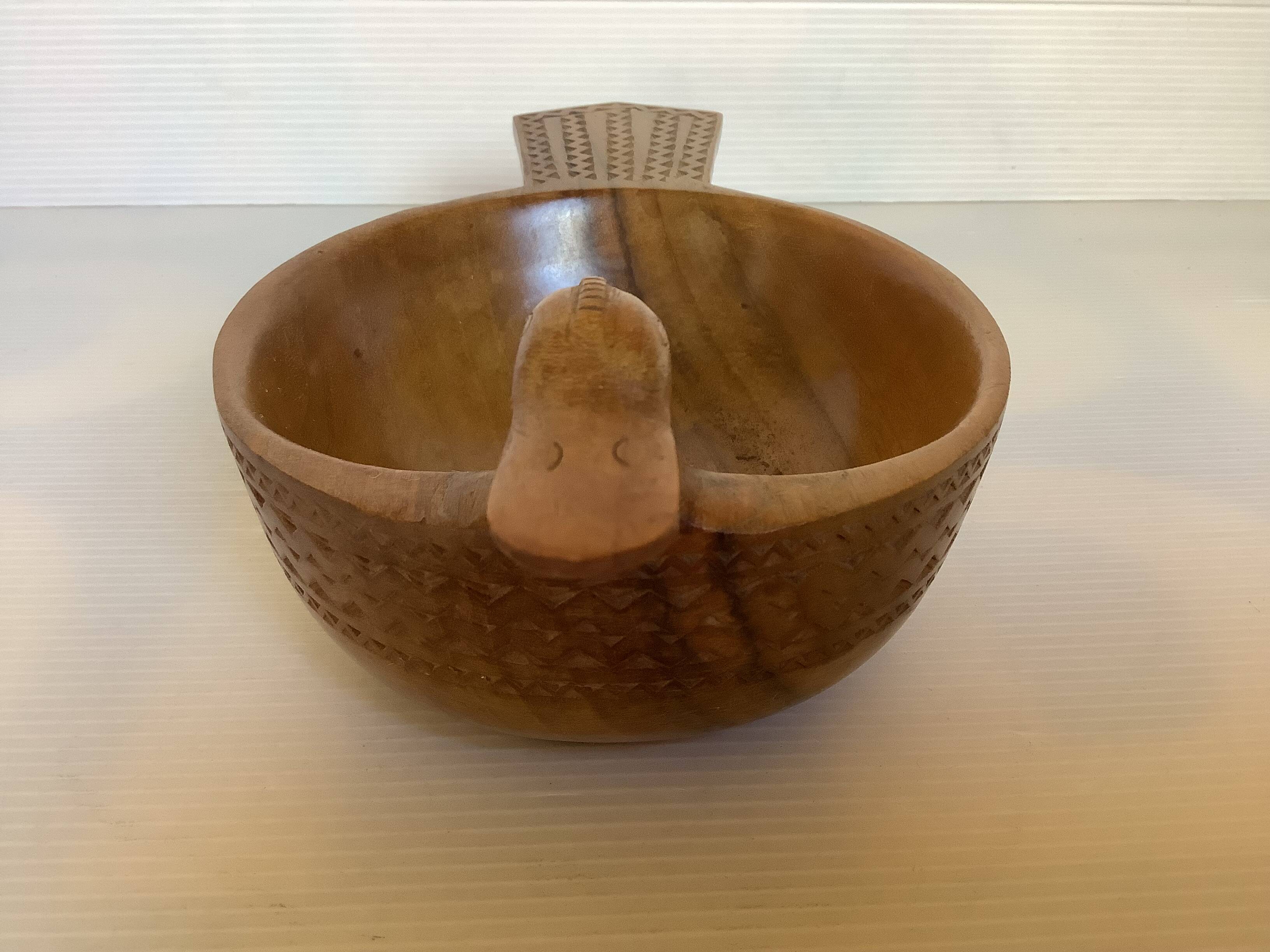 Carved wooden bird pocket