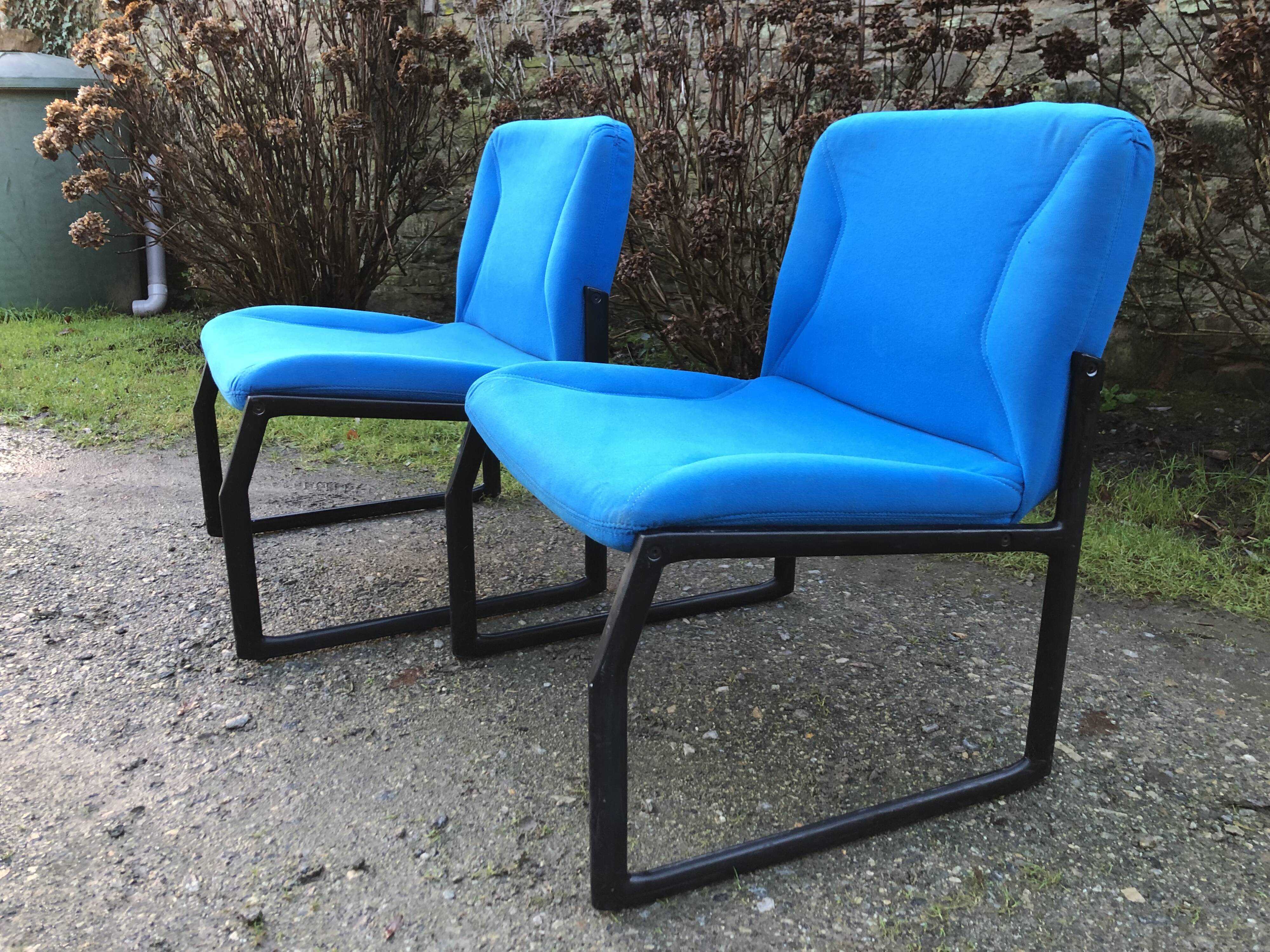 Electric blue fabric designer armchairs with black lacquered metal legs from the 80s.