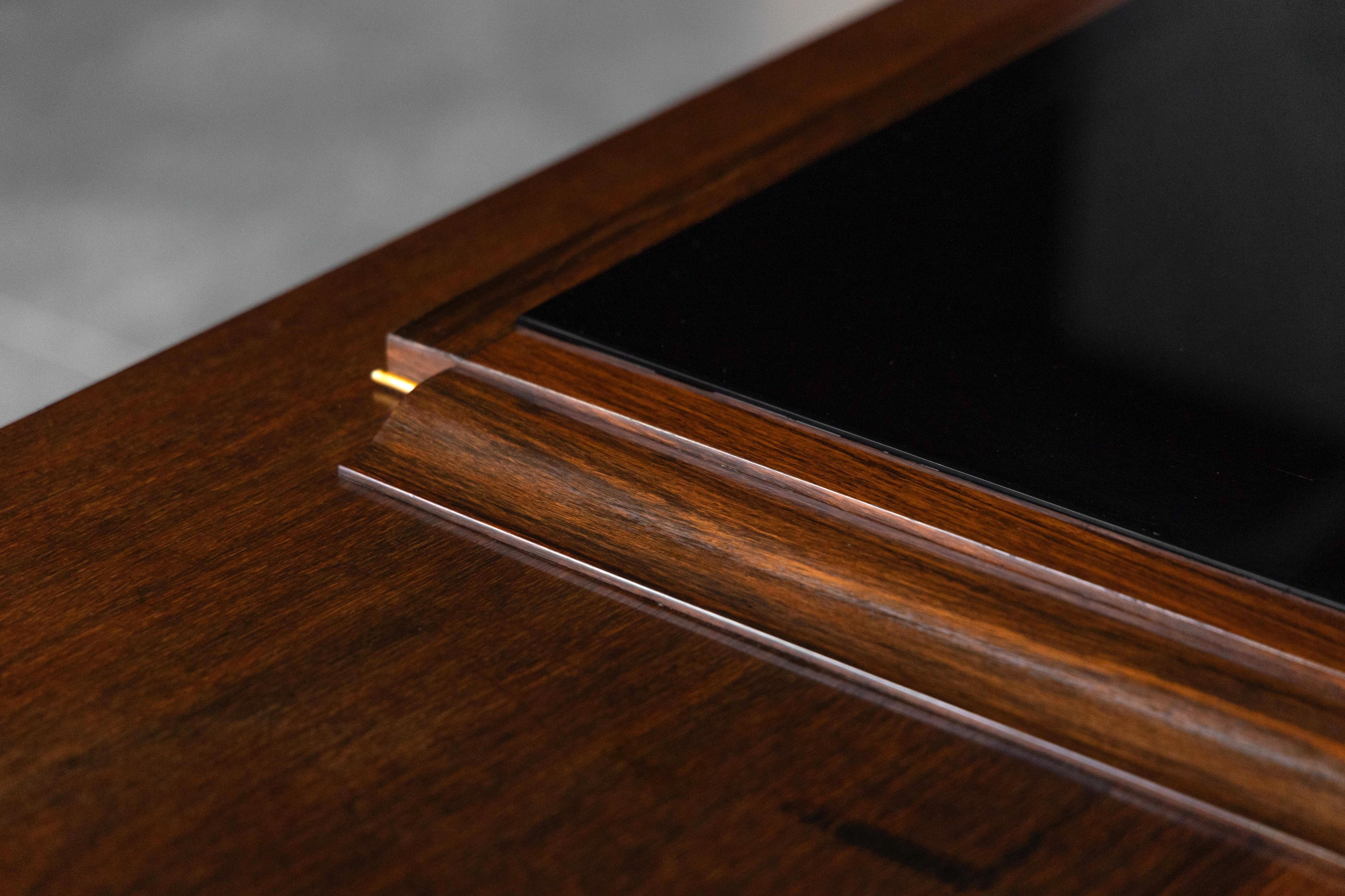 Art Deco walnut sideboard with brass details and sculptural base, France, 1930s