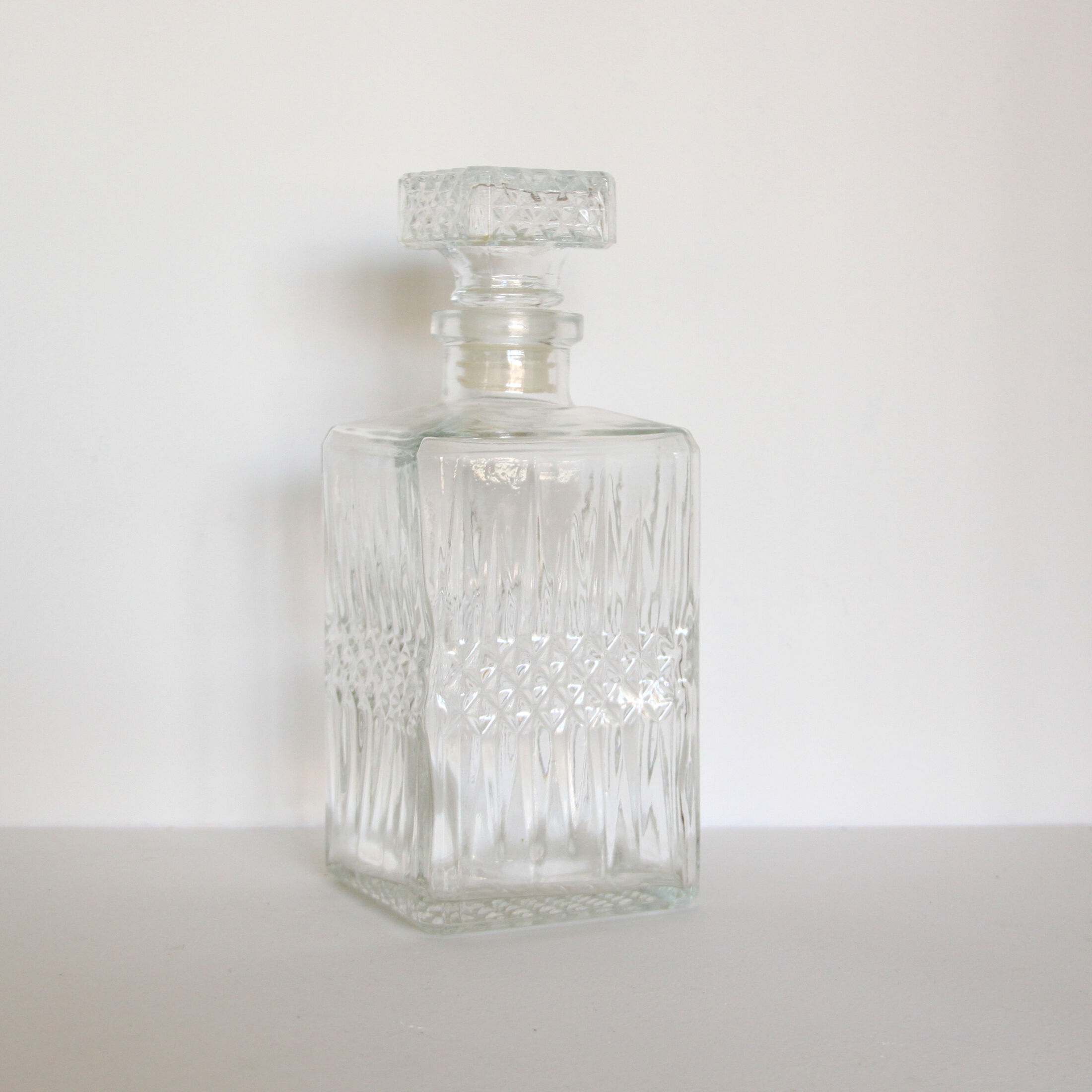 Old vintage glass whisky decanter