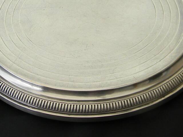 Silver-plated trivet.