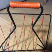 Vintage red and black scoubidou magazine rack, 1950s/60s