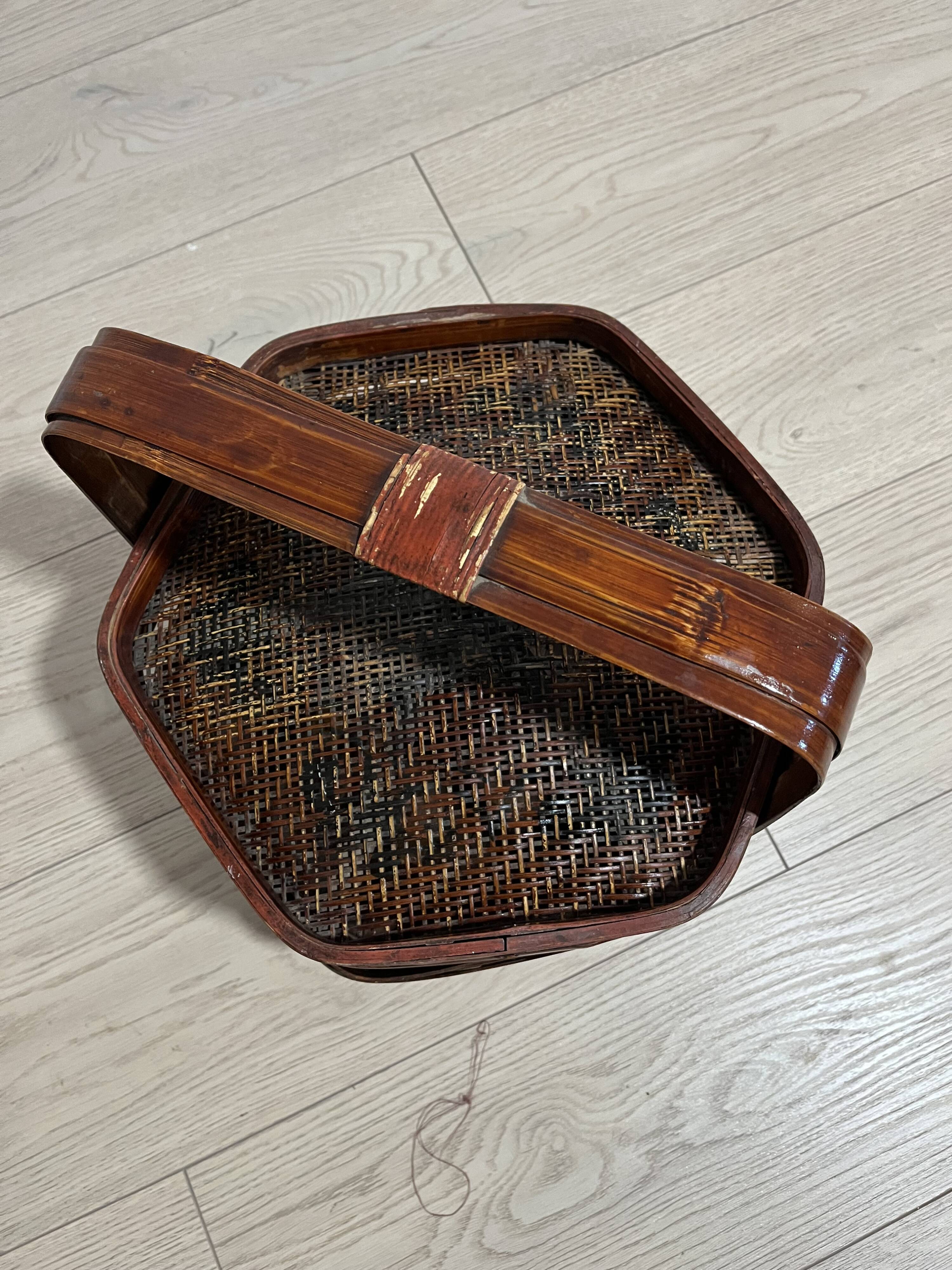 Ancient wooden and woven wicker basket,