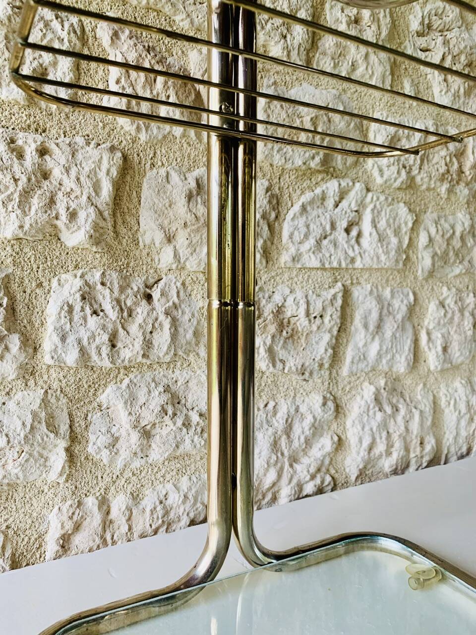 Glass and brass side table with magazine rack, circa 1970's