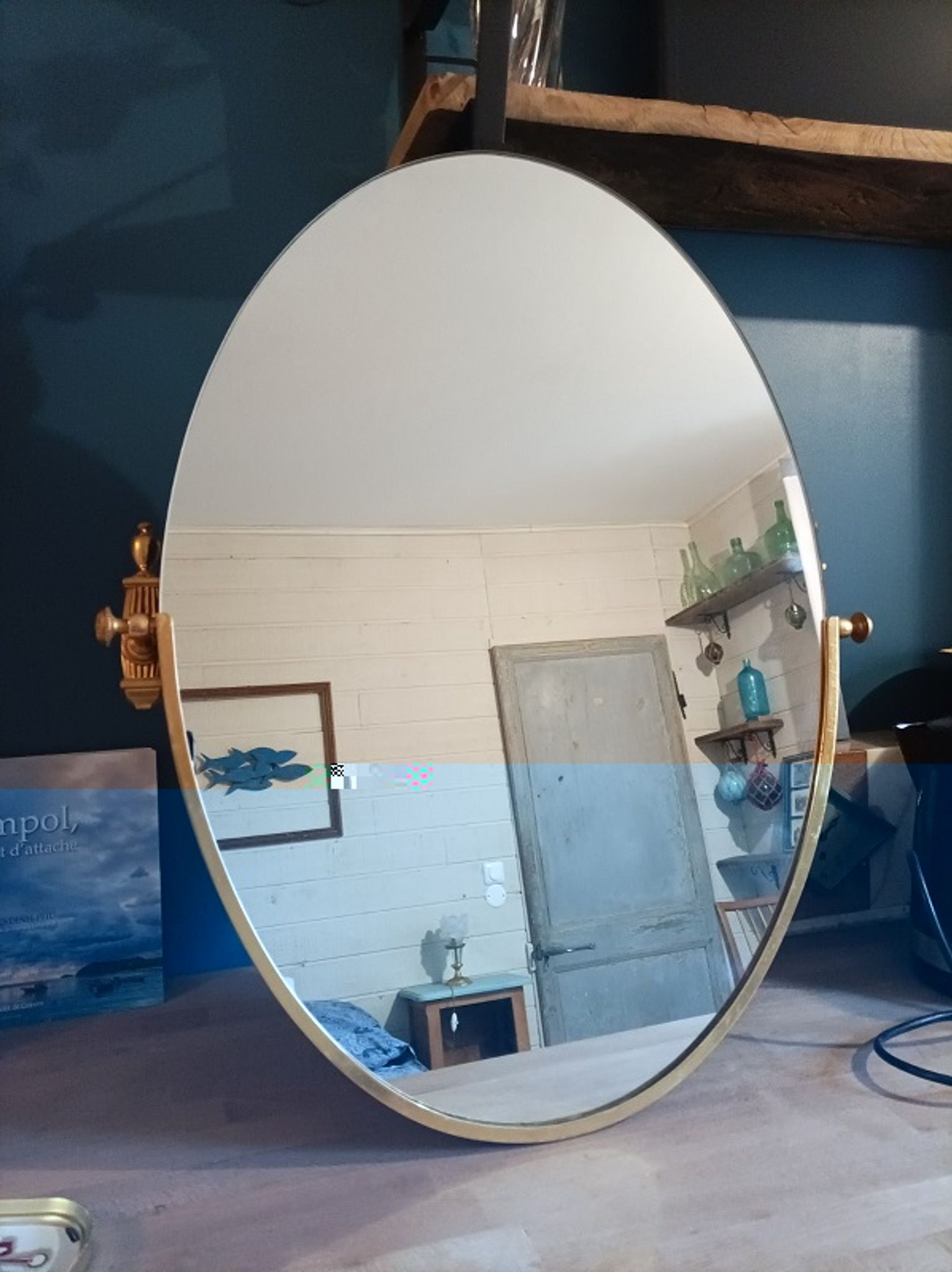 Oval mirror patinated brass frame art deco