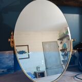 Oval mirror patinated brass frame art deco