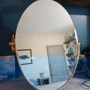 Oval mirror patinated brass frame art deco
