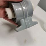 Bathroom lamp with light gray ceramic base,  and milky white opal glass.