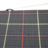 Green scottish fabric case with key