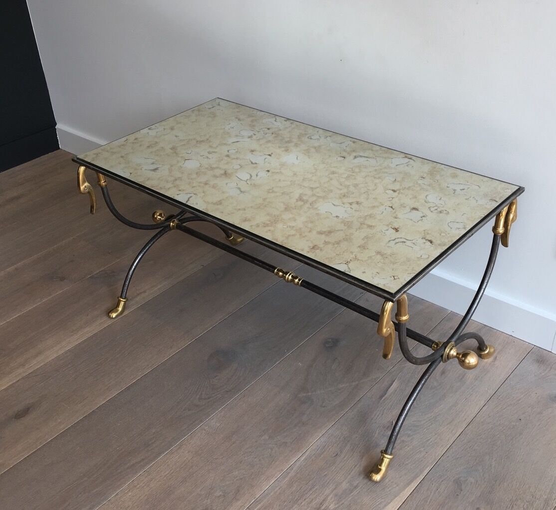 Coffee table in brushed steel and brass
